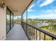Screened balcony offering waterfront views, complete with a ceiling fan at 25188 Marion Ave # D308, Punta Gorda, FL 33950