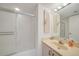 Clean bathroom featuring a shower/tub combination and a sink with vanity and mirrored wall at 25188 Marion Ave # D308, Punta Gorda, FL 33950