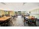Bright common room with tables, chairs, and tile floors at 25188 Marion Ave # D308, Punta Gorda, FL 33950