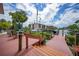 Waterfront condo complex boasts a private dock with boat slips and relaxing lounge area with seating and lush greenery at 25188 Marion Ave # D308, Punta Gorda, FL 33950