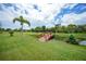 The complex offers lush grounds with mature trees and a quaint bridge over a waterway at 25188 Marion Ave # D308, Punta Gorda, FL 33950