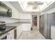 A well-equipped kitchen with stainless steel appliances, light cabinetry, and a view into the dining area at 25188 Marion Ave # D308, Punta Gorda, FL 33950