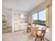 Living area by a window offering natural light, cozy seating, and views of the waterfront at 25188 Marion Ave # D308, Punta Gorda, FL 33950