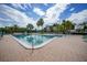 Resort-style pool area with turquoise lounge chairs at 25188 Marion Ave # D308, Punta Gorda, FL 33950