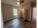 Cozy bedroom with a closet, wood-look floors, and a ceiling fan at 302 Albatross Rd, Rotonda West, FL 33947