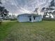 Charming single-story home with a spacious yard and covered porch, perfect for outdoor living at 302 Albatross Rd, Rotonda West, FL 33947