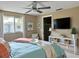 Cozy bedroom with a television, a neutral decor, and a comfortable bed at 3415 Gulf Ln, Rotonda West, FL 33947