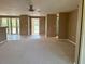 Spacious living area with neutral carpet and multiple entryways at 3415 Gulf Ln, Rotonda West, FL 33947