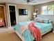 Serene main bedroom featuring soothing colors, a ceiling fan, and plenty of natural light at 3415 Gulf Ln, Rotonda West, FL 33947