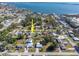 Aerial view of home, showcasing water access and community featuring mature trees and landscaping at 350 W Cowles St, Englewood, FL 34223