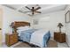 Cozy bedroom with a ceiling fan, wicker furniture and nautical accents at 350 W Cowles St, Englewood, FL 34223