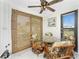 Bright dining area with a glass table, bamboo blinds, and a ceiling fan at 350 W Cowles St, Englewood, FL 34223