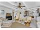 Open living space with a fireplace, casual seating, and views into the kitchen at 350 W Cowles St, Englewood, FL 34223