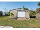 Exterior shot of the shed with weathered wooden entrance at 350 W Cowles St, Englewood, FL 34223
