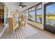 The bright and airy lanai showcases an outdoor dining area overlooking the water at 410 Blue Springs Ct # 189, Englewood, FL 34223