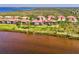 Aerial view of waterfront homes showcasing serene views and community setting at 4692 Club Dr # 101, Port Charlotte, FL 33953