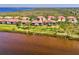 Aerial view of waterfront homes showcasing serene views and community setting at 4692 Club Dr # 101, Port Charlotte, FL 33953