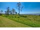 Backyard showcasing stunning water views and lush green space for outdoor enjoyment at 4692 Club Dr # 101, Port Charlotte, FL 33953
