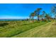 Backyard showcasing stunning water views and lush green space for outdoor enjoyment at 4692 Club Dr # 101, Port Charlotte, FL 33953