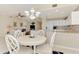 Cozy dining area adjacent to kitchen and living room at 4692 Club Dr # 101, Port Charlotte, FL 33953