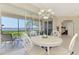Nice dining area with lanai access and serene water view at 4692 Club Dr # 101, Port Charlotte, FL 33953