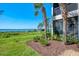 Exterior view of home showcasing lush landscaping and tranquil waterfront setting at 4692 Club Dr # 101, Port Charlotte, FL 33953