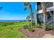 Exterior view of home showcasing lush landscaping and tranquil waterfront setting at 4692 Club Dr # 101, Port Charlotte, FL 33953