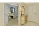 Inviting foyer with tile flooring, complemented by a decorative cabinet and a glimpse into the elegant living room at 4692 Club Dr # 101, Port Charlotte, FL 33953