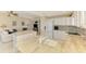 Open kitchen with granite countertops, stainless steel appliances, and ample counter space at 4692 Club Dr # 101, Port Charlotte, FL 33953