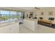 Bright open kitchen with granite countertops, stainless appliances, and water view at 4692 Club Dr # 101, Port Charlotte, FL 33953