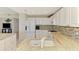 Open kitchen with granite countertops, stainless steel appliances, and kitchen island at 4692 Club Dr # 101, Port Charlotte, FL 33953