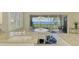 Bright eat-in kitchen with granite countertops, white cabinets and lovely water view at 4692 Club Dr # 101, Port Charlotte, FL 33953