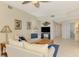 Spacious living area featuring neutral decor, tile flooring, and an open layout leading to the kitchen and dining areas at 4692 Club Dr # 101, Port Charlotte, FL 33953