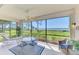 Screened patio featuring comfortable seating and scenic water views for relaxing and entertaining at 4692 Club Dr # 101, Port Charlotte, FL 33953
