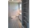 Well-lit bathroom with built in shelf and a tiled floor at 5234 Forbes Ter, Port Charlotte, FL 33981