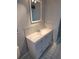 Bathroom features a white vanity and tiled wall at 5234 Forbes Ter, Port Charlotte, FL 33981