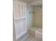 Bathroom featuring retro-style tile, bathtub and sink at 5234 Forbes Ter, Port Charlotte, FL 33981