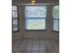 Bright breakfast nook boasts bay windows with water views and tile flooring at 5234 Forbes Ter, Port Charlotte, FL 33981