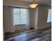 Bright dining area features new flooring, modern lighting, and window with sheer curtains at 5234 Forbes Ter, Port Charlotte, FL 33981