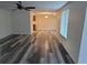 A spacious living room with new flooring, fresh paint, and ample natural light creates a welcoming atmosphere at 5234 Forbes Ter, Port Charlotte, FL 33981