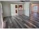 This living room features gray wood-look floors and an open floorplan at 5234 Forbes Ter, Port Charlotte, FL 33981