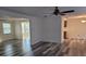 View of living area with new flooring, ceiling fan, and view of dining area and possible kitchen at 5234 Forbes Ter, Port Charlotte, FL 33981