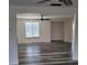 Spacious living area with wood-look flooring and open entryway at 5234 Forbes Ter, Port Charlotte, FL 33981
