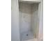 Modern walk-in shower featuring a marble tile surround and tiled floor at 5234 Forbes Ter, Port Charlotte, FL 33981
