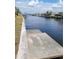A concrete dock provides easy access to the tranquil canal waters at 5234 Forbes Ter, Port Charlotte, FL 33981