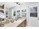 Bright bathroom with a large mirror, vanity, sink, and outdoor access door at 533 Boundary Blvd, Rotonda West, FL 33947