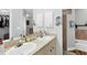 Bathroom featuring double sinks with modern fixtures and a neutral color scheme at 533 Boundary Blvd, Rotonda West, FL 33947