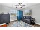 Comfortable bedroom with modern furnishings, a large window, and hardwood floors at 533 Boundary Blvd, Rotonda West, FL 33947