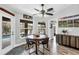 Charming breakfast nook with backyard pool views and seating for four people at 533 Boundary Blvd, Rotonda West, FL 33947