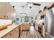 Bright kitchen with wood floors and cabinets, stainless steel appliances and views of the yard at 533 Boundary Blvd, Rotonda West, FL 33947